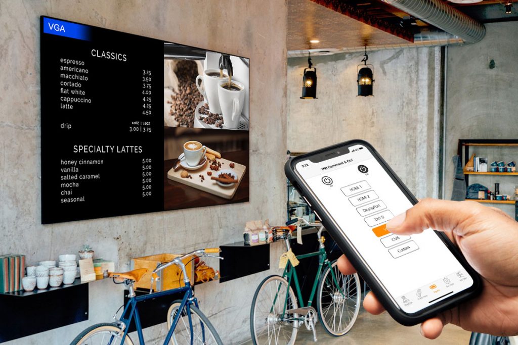 A person is using display management software to control AG Neovo's displays on iPhone