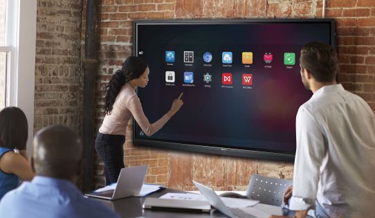 A girl is using her fingers to touch app on Meetboard IFP-series interactive flat panel display