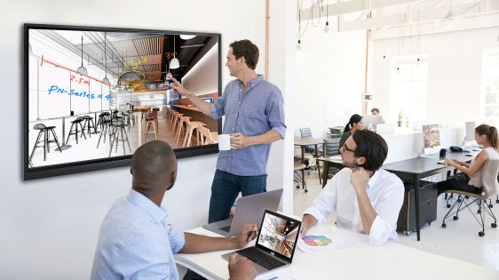 A man is using fingers to draw on Meetboard IFP-series interactive flat panel display