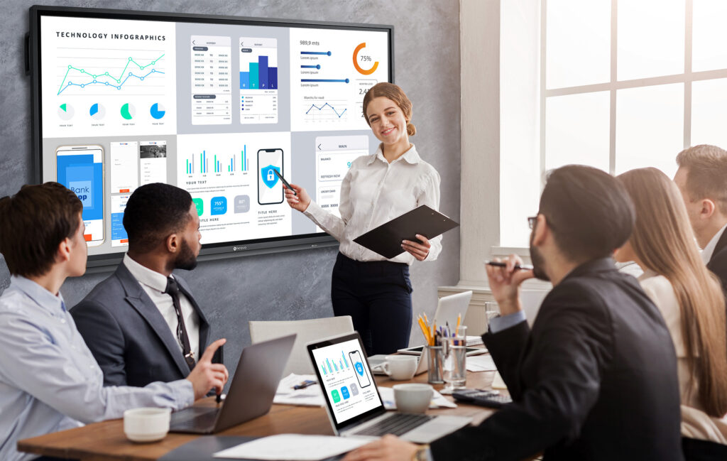 A group of people is screen mirroring on Meetboard interactive display in a meeting room