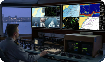 A man is looking at professional marine display monitors used for high-definition data visualization and auxiliary monitoring in a maritime command center._Mobile Version